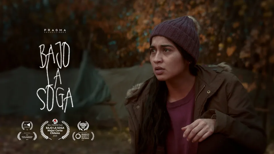 Official Bajo la Soga poster showing a woman in a knitted hat